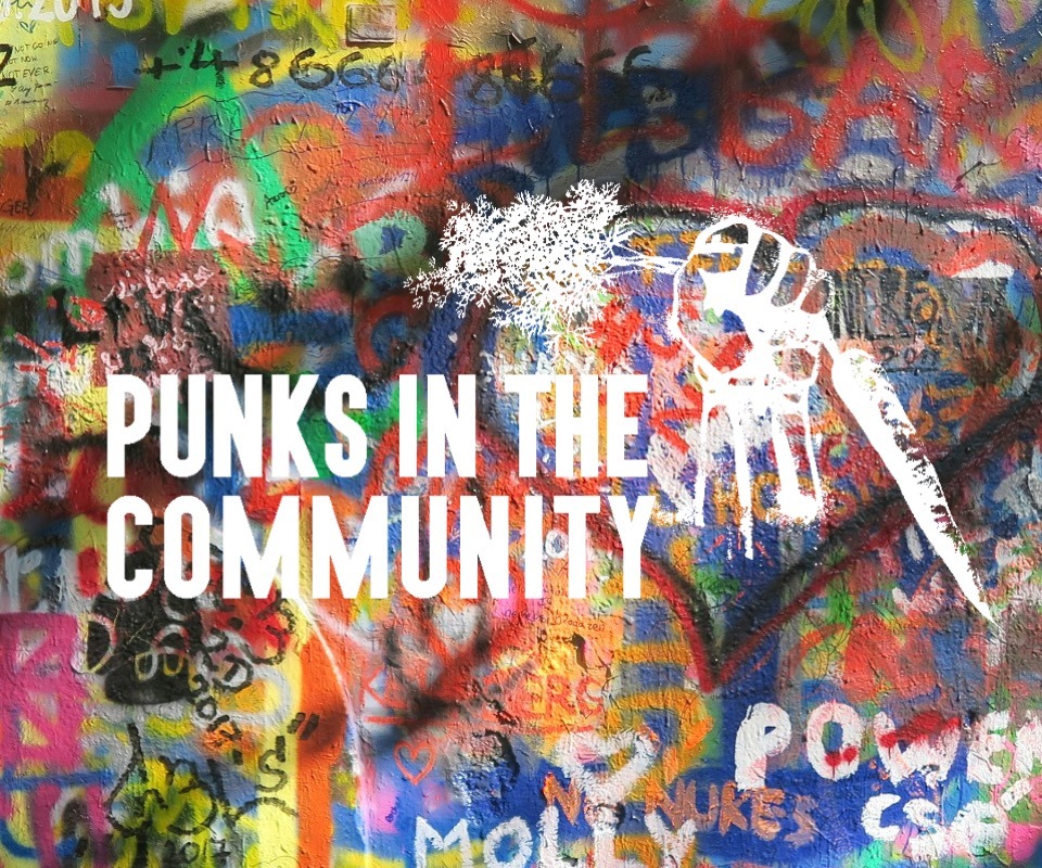Punks In The Community, grafitti wall with a fist holding a carrot aloft